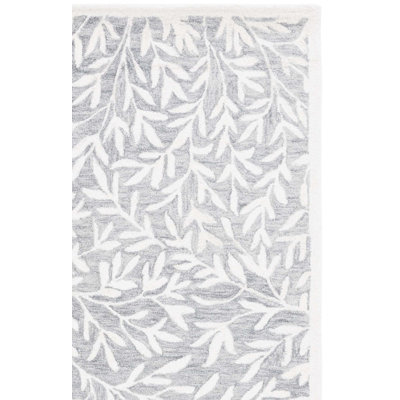 Ingurs Hand Tufted Wool/Cotton Floral Rug in Gray/Ivory
