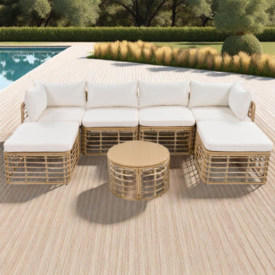 Ensemble de canapé modulaire d'extérieur en osier 7 pièces avec coussins, repose-pieds et table basse ronde en polyéthylène 7 pièces
