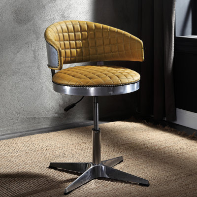 Tabouret en cuir de curcuma avec base et siège pivotants, structure ergonomique en métal pour une mobilité optimale