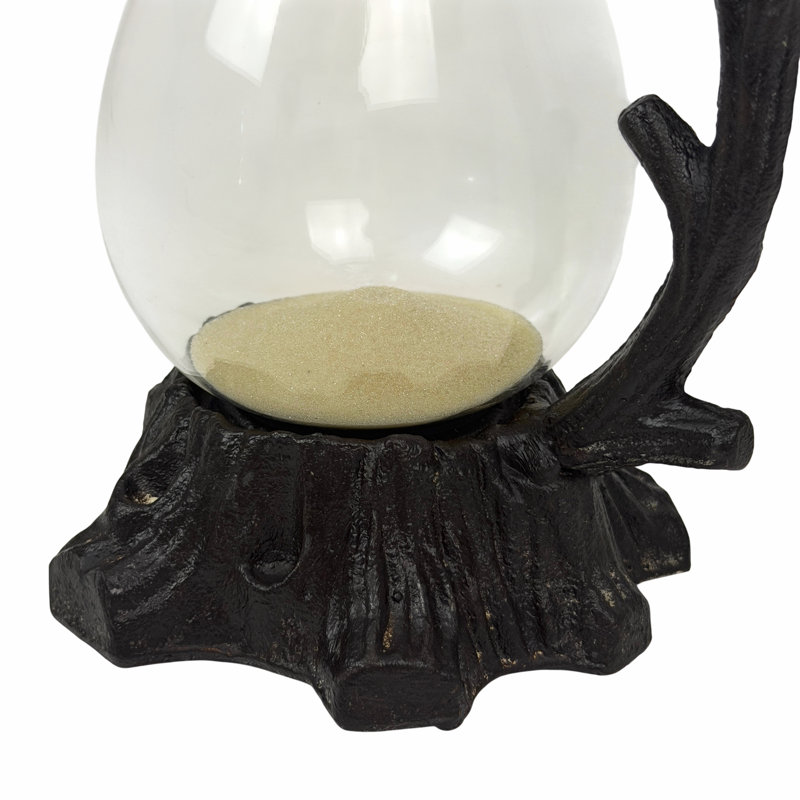 Antiqued cast iron branch hourglass timer with tan sand and hand-blown glass, 11.25 inches high
