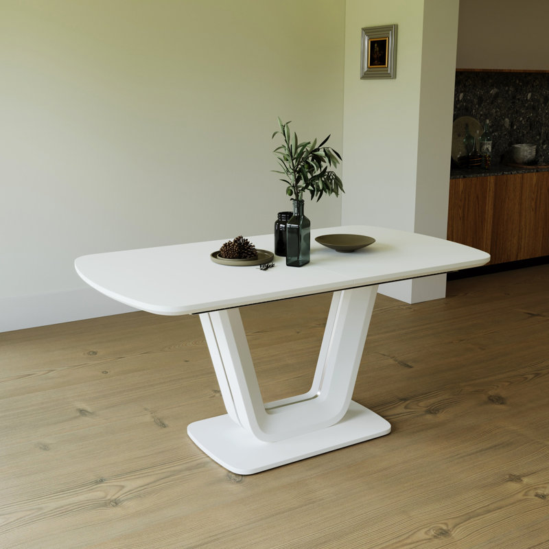 Table de salle à manger blanche extensible avec pieds robustes en forme de U pour une polyvalence élégante