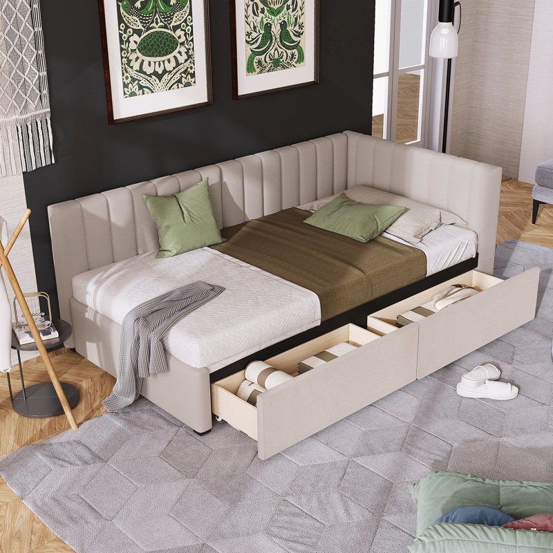 Lit de jour rembourré confortable avec deux tiroirs de rangement spacieux et une construction robuste pour une utilisation polyvalente à la maison.
