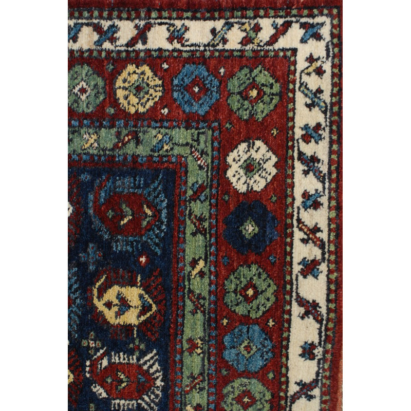 Seychour Wool Oriental Area Rug in Green/Red