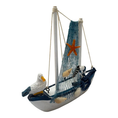 Figurine voilier avec goéland et filet de pêche