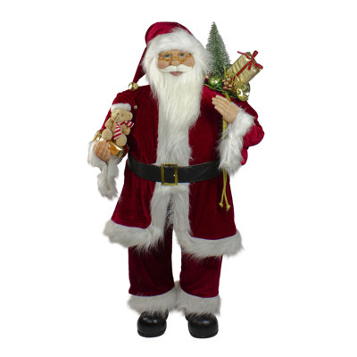 Figurine de père Noël avec sac-cadeau