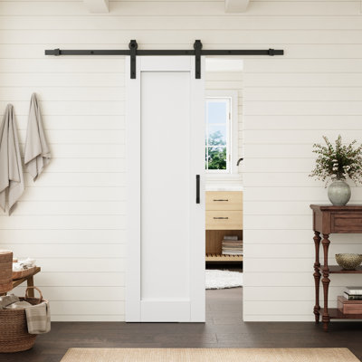 Porte intérieure standard à un panneau, 24 po x 80 po, âme pleine, apprêtée et préfinie, avec ensemble de quincaillerie noire pour porte de grange