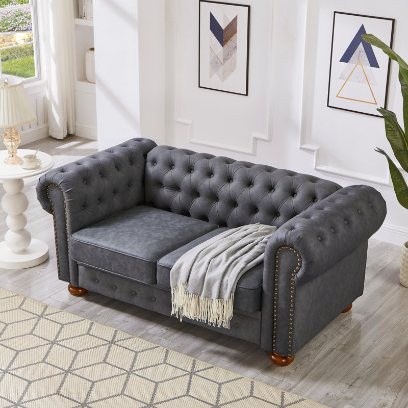 Causeuse de canapé classique en similicuir Chesterfield