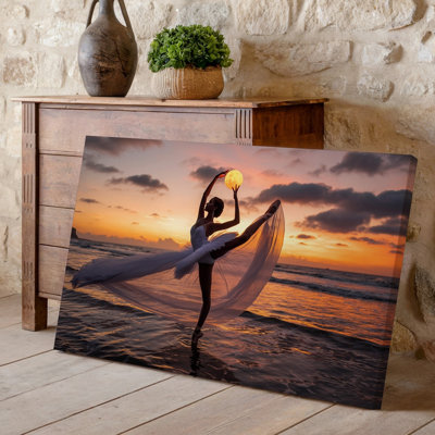 Canvas A Graceful Ballerina Dances On The Edge Of The Ocean Wall Art At Sunset Her Flowing Sheer White Tutu Resembling Waves As Canvas Wall Art