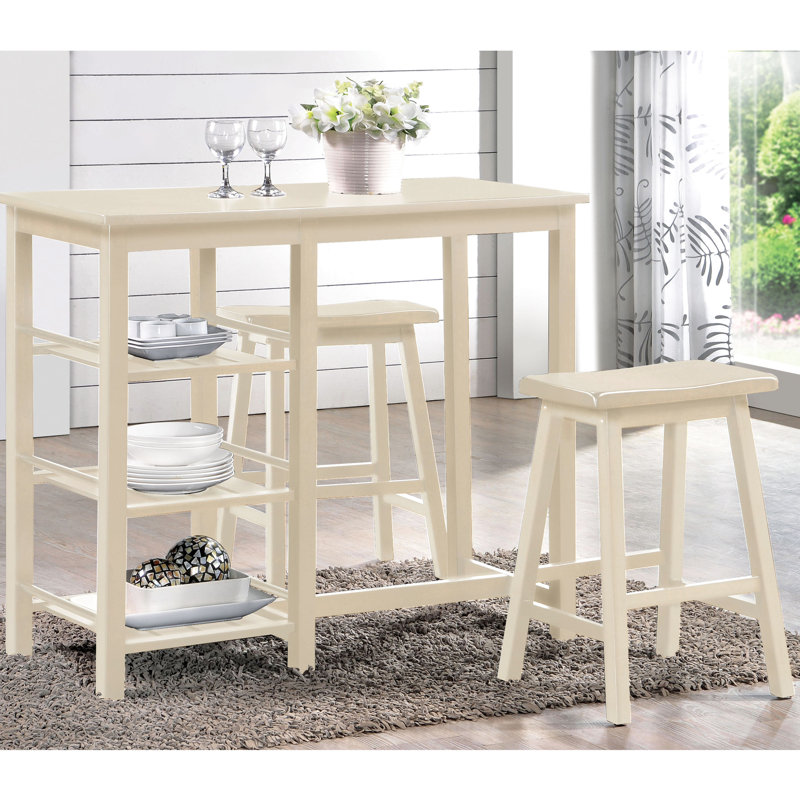 Configuration de salle à manger à 3 comptoirs. Table avec 3 tablettes ouvertes. Tabourets de selle pour plus de confort. Pieds en bois. Convient aux petites zones colorées. Rangement relaxant. Structure en bois. Convient aux espaces compacts