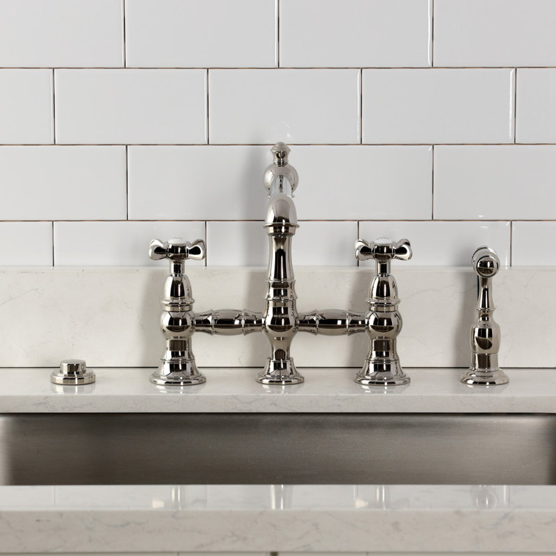 Kingston Brass Essex Two-Handle 4-Hole Deck Mount Bridge Kitchen Faucet with Brass Side Sprayer, Polished Nickel