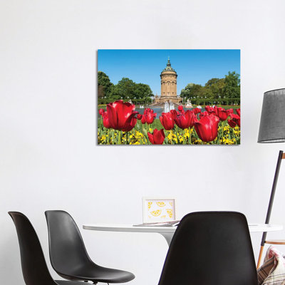 Red Tulip Flowers At The Mannheim Wasserturm In Spring, Baden-Württemberg, Germany by Jan Becke - Wrapped Canvas Print
