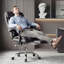 Fauteuil de bureau avec hauteur réglable et repose-pieds, fauteuil de jeu inclinable à dossier haut, cuir noir, roulettes, inclinaison à 135°, base en métal et bois, rembourrage en mousse à mémoire de forme, montage facile pour un confort optimal