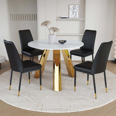 A 42-Inch Round Dining Table with A Granite Top and Stainless Steel Legs, Paired with Four Pu Material Dining Chairs