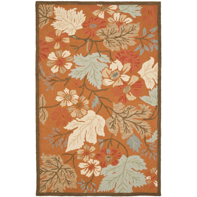 Emrick Hand Hooked Wool/Cotton/Latex Floral Rug in Orange
