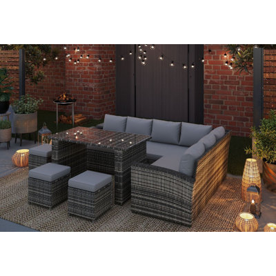 Apeksha 9 - Person Patio Dining Set Rectangular Table with Cushions Included