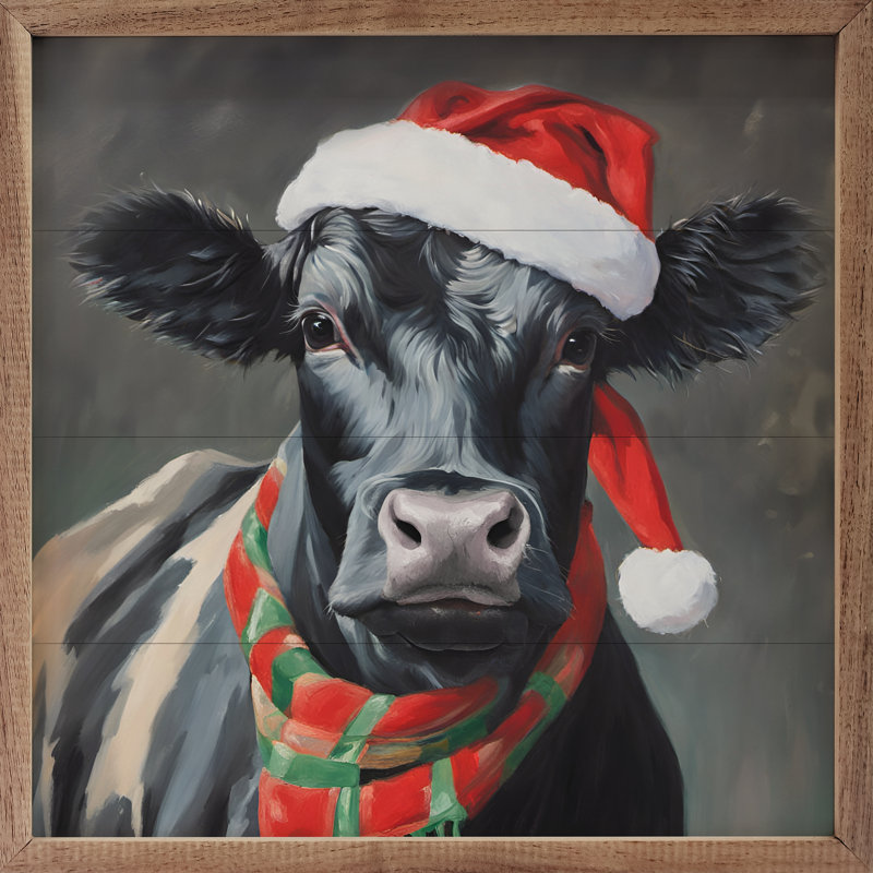 Vache du Père Noël avec chapeau et écharpe