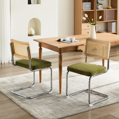 Of 2 Mid Century Modern Dining Chairs, Olive Velvet Cushioning, Cane Back, Stainless Base, Cantilever Design For Firm Support Olive Cushion, Natural Backing, Longevity