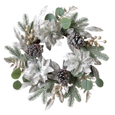 Couronne de Noël avec poinsettia, pommes de pin et eucalyptus