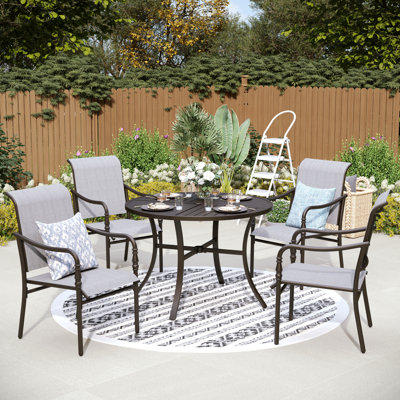 Ensemble repas d'extérieur pour 4 personnes avec chaises en métal Carli (sans coussins) Carli