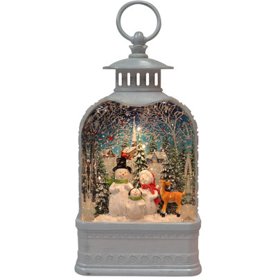 Lanterne en acrylique H 9,5 po avec famille de bonhommes de neige - DEL, paillettes d'eau tournantes, pile - résine peinte à la main