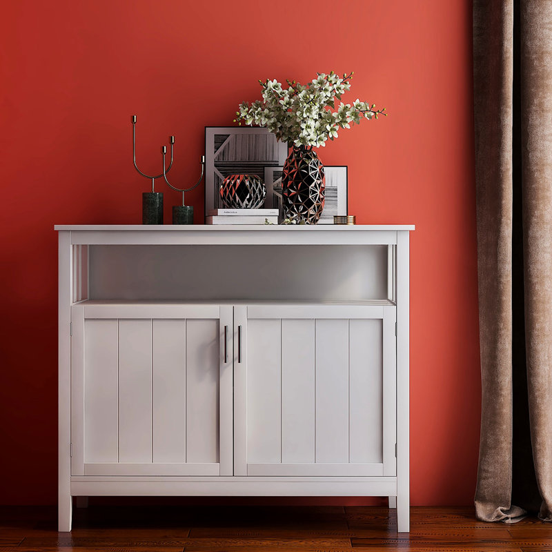 Kitchen Buffet Server Cabinet In White. E1 Construction. Coated Surface For Durability. Spacious Storage With Adjustable Shelves. Easy Assembly All Components Included. Safe Magnetic Door Components.