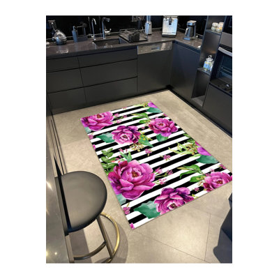 Tapis tissé mauve à motif floral coloré