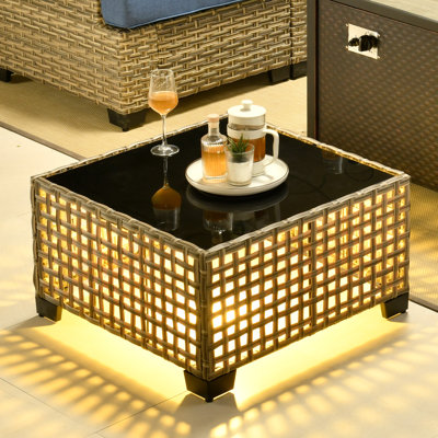 7- Person Rattan Outdoor Seating Group With Swivel Rockers and Fire Pit Table