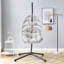 Chaise suspendue en fer robuste avec tissage en osier-306305942