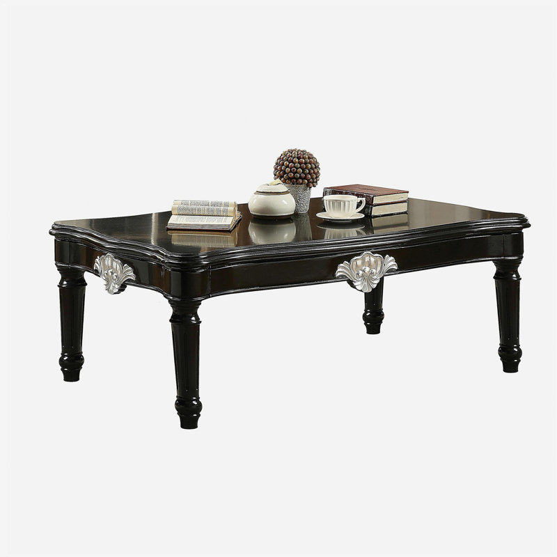 Table basse noire à pieds rotatifs