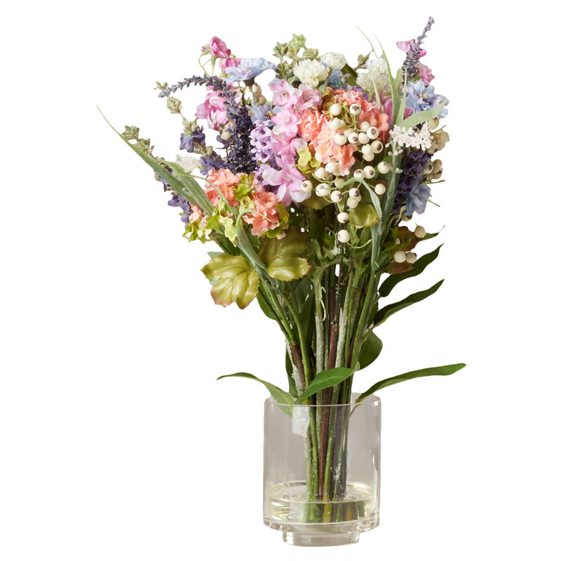 Arrangement floral mélangé dans un vase en verre