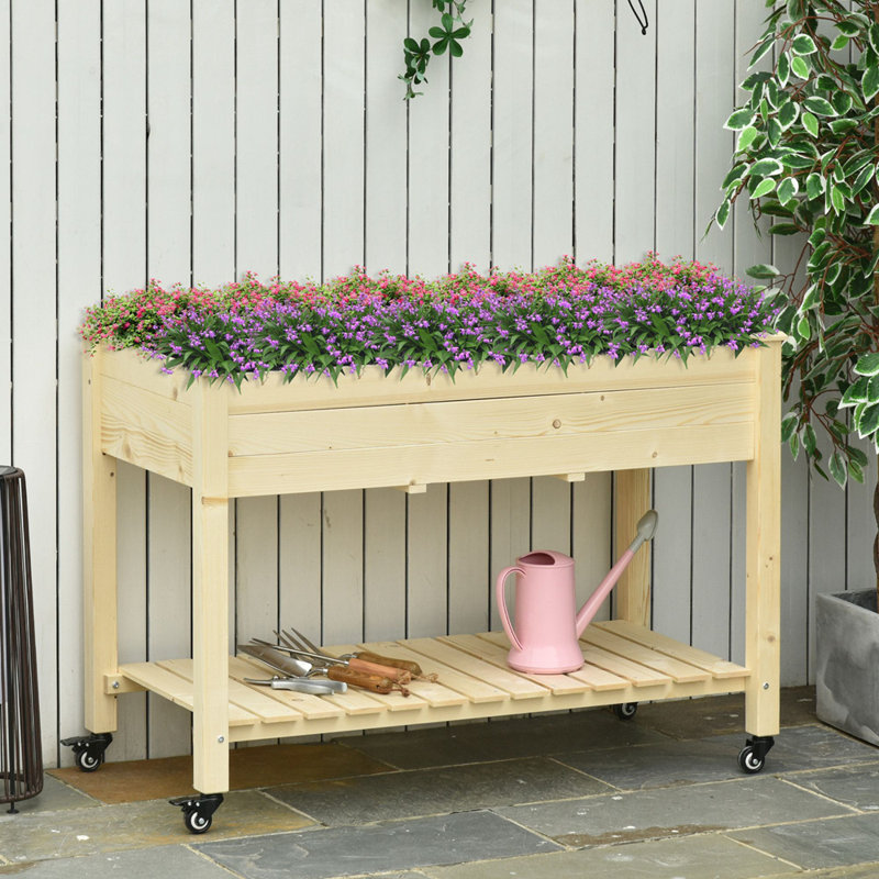 Lit de jardin surélevé Outsunny, 47 po x 22 po x 33 po, jardinière en bois surélevée avec roues verrouillables, tablette de rangement et doublure de lit pour la cour, le patio