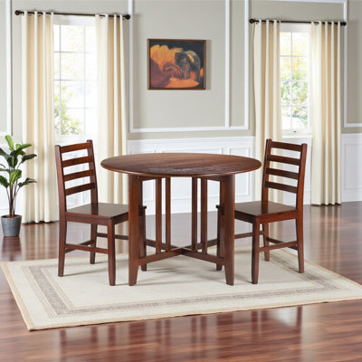 Jachai Walnut round drop leaf table with ladder-back chairs