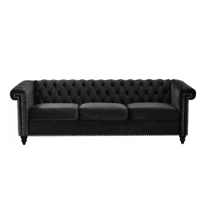 Charmant fauteuil 3 places en velours noir avec capitonnage à boutons profonds et ambiance invitante - 3 matériaux gracieux