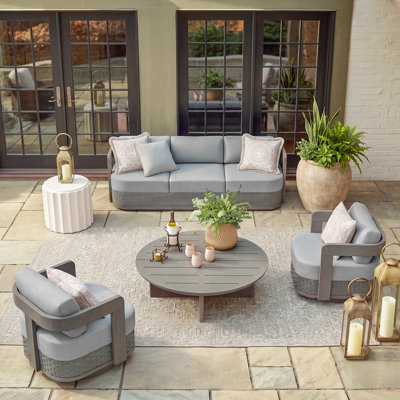 Ensemble de conversation pivotant Manarola Patio en aluminium et résine tressée PE avec coussins Sunbrella® pour 5 personnes