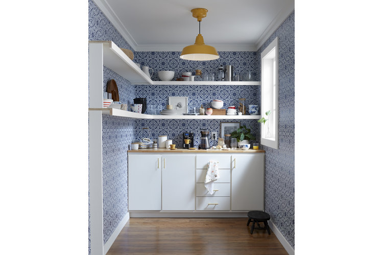wallpapered kitchen with wraparound shelves