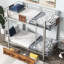 Lit superposé simple au dessus d'un lit simple en argent avec métal-696046351
