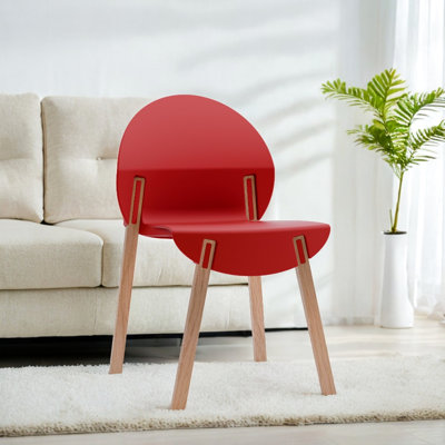 4 chaises d'intérieur tropicales orange avec des pieds en chêne rouge et un siège en polypropylène, une construction résistante aux égratignures, un grain de bois naturel massif, des joints renforcés pour un soutien lourd, des coussinets souples de