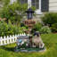 Statue de planteur de chien carlin assis