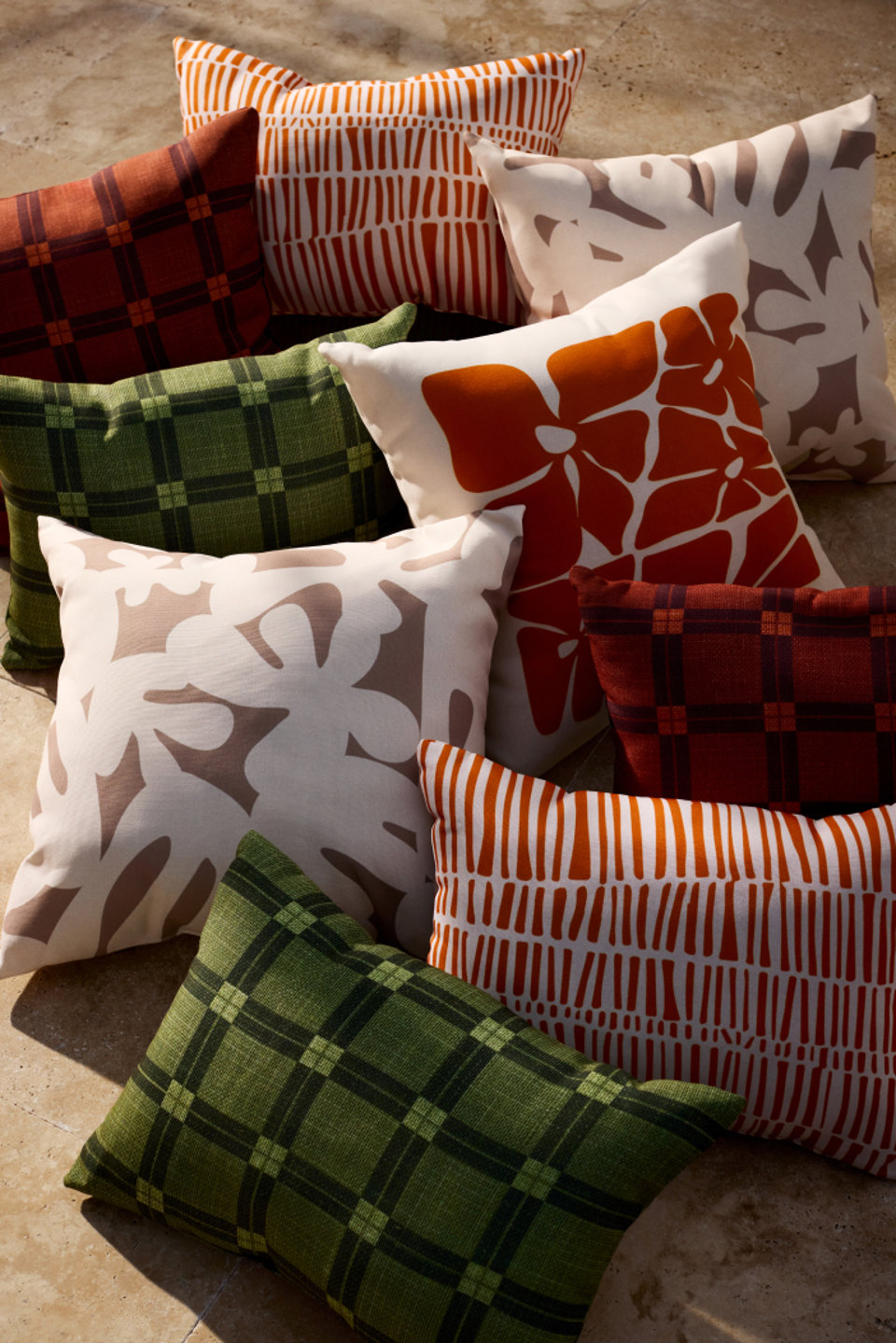 Pile of decorative pillows in various patterns.