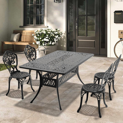 5 meubles de salle à manger en fonte d'aluminium résistant aux intempéries. Cadre noir, chic moderne. Fabrication 100% résistante aux intempéries et à la corrosion. Siège ergonomique. Coussin en nylon Slip Pa66 Facile à assembler. Seats 4. Table rectangulaire