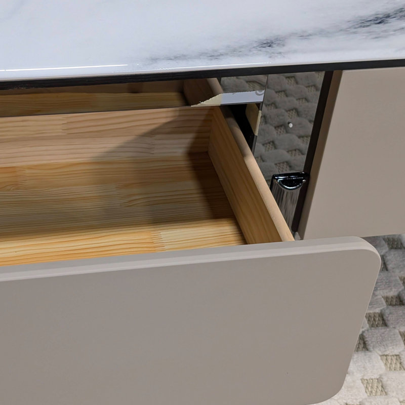Table basse avec pierre veinée et tiroir à fermeture en douceur
