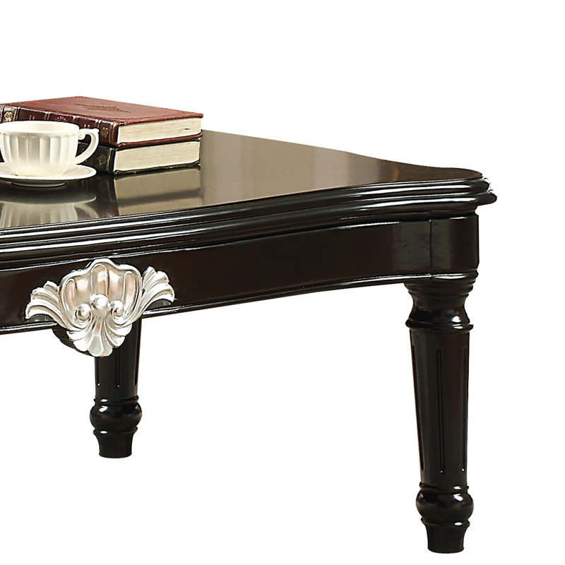Table basse noire avec pieds tournés