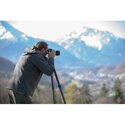 Photographer taking picture of a mountain