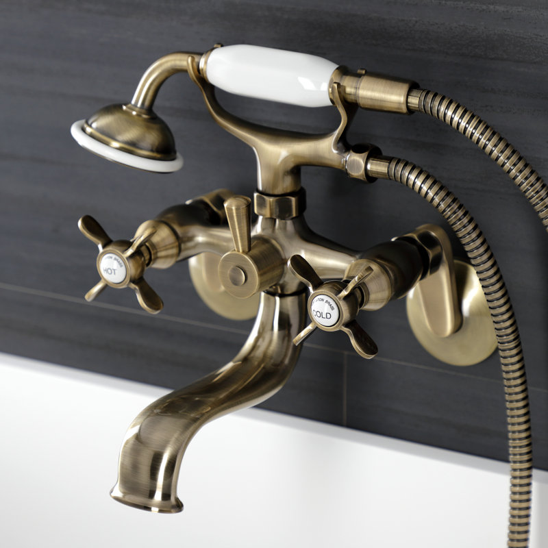 Kingston Brass Essex Three-Handle 2-Hole Wall Mount Clawfoot Tub Faucet with Handshower, Antique Brass