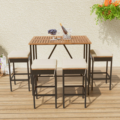 Ensemble de table de salle à manger 5 pièces à hauteur de bar et quatre tabourets avec coussins