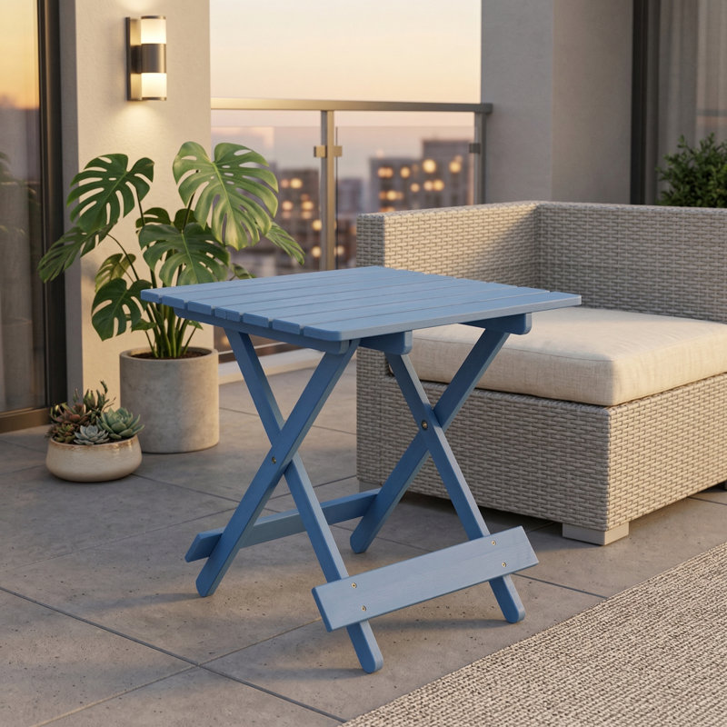 Square outdoor table with a folding design for space-saving storage. Constructed from solid wood, suitable for patios or balconies. Available in a blue color.