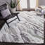 Tapis gris / vert abstrait Grovesend-556552129