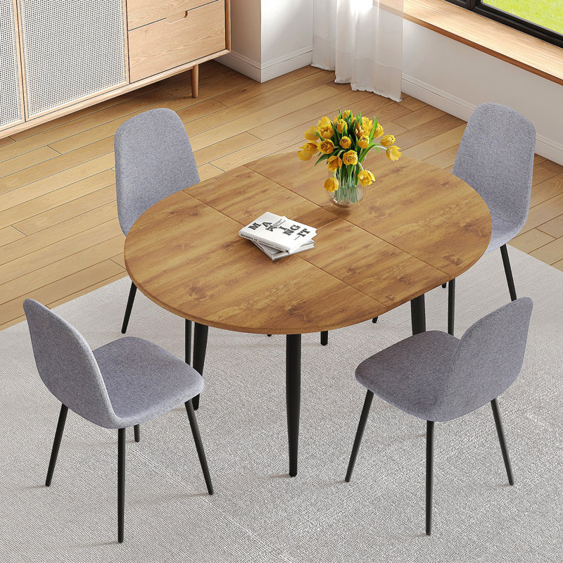 Ensemble de table et de chaises. Table de salle à manger extensible moderne en bois aggloméré. Convient pour des rassemblements de différentes tailles. Combinée avec 4 chaises de salle à manger en lin et coton gris clair à haute résilience.