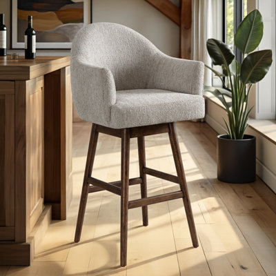 Tabouret de bar pivotant rembourré en bois massif avec siège en tissu Wasserman