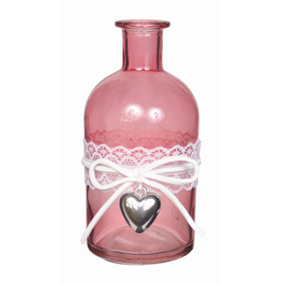 Vase rose avec ruban blanc